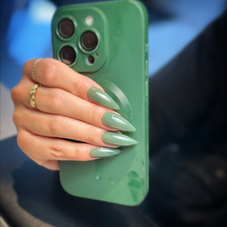 Green chrome BIAB nails with metallic finish in Amsterdam