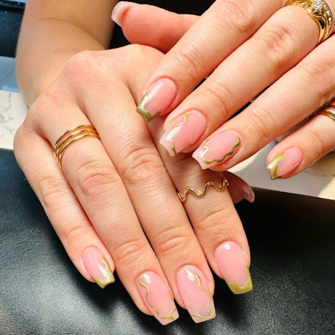 Natural nude gel manicure with subtle glitter finish in Amsterdam nail salon